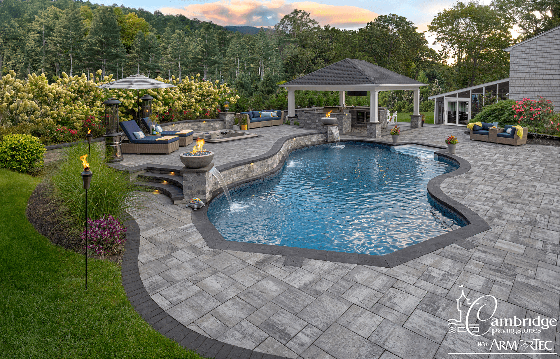 Pavers around a pool and outdoor living area.