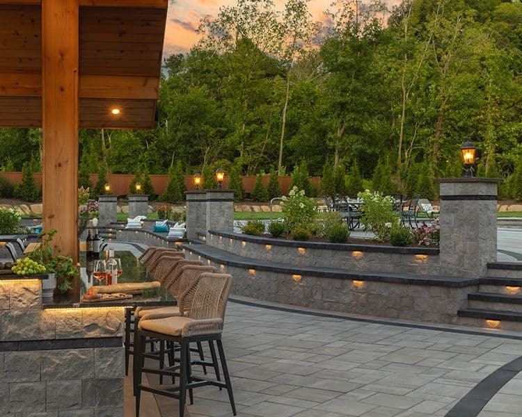 A stone wall behind an outdoor bar
